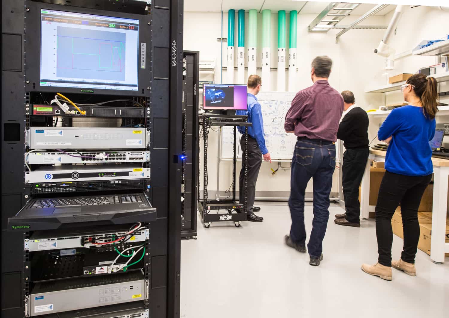January 14, 2016 - Brian Miller, Maurice Martin, Randy Hunsberger, and Ivonne Pena, with the Cyber-Physical Systems Center, work through a scenario in the NLR Cyber Test Bed at the ESIF.